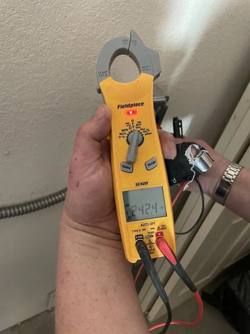 Voltage testing with clamp meter during Outlet Installation in Goldsboro